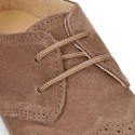 Kids laces up shoes with laces closure and chopped design in suede leather.