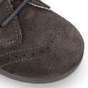 Kids laces up shoes with laces closure and chopped design in suede leather.