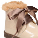 Girl safari boots with ties closure and fake hair neck in PATENT leather.