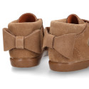Girl Suede leather little bootie laceless with bow and chopped design.