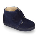 Suede leather little bootie sneaker style with fake hair lining and laceless in fall colors.