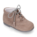 Suede leather Welsh or English style ankle boots with tassels.