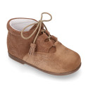 Suede leather Welsh or English style ankle boots with tassels.