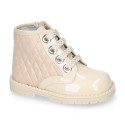 ROCK style BEIGE patent leather girl boots with metal ties closure.