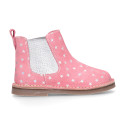 Suede leather ankle boot shoes with stars print design.