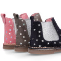 Suede leather ankle boot shoes with stars print design.