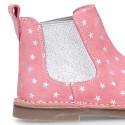 Suede leather ankle boot shoes with stars print design.