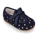Suede leather laces up shoes with stars print design.
