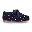 Suede leather laces up shoes with stars print design.