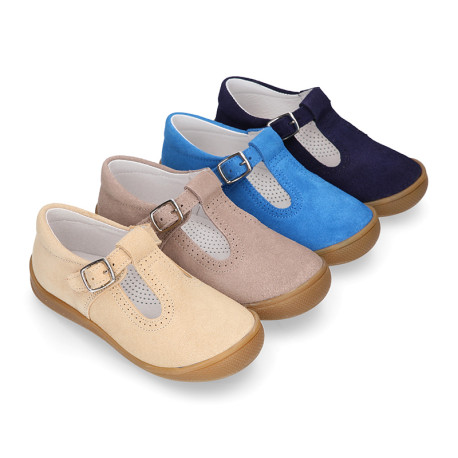 Classic suede leather T-strap shoes with toe cap and buckle fastening.