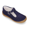 Classic suede leather T-strap shoes with toe cap and buckle fastening.