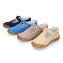 Classic suede leather T-strap shoes with toe cap and buckle fastening.