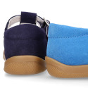 Classic suede leather T-strap shoes with toe cap and buckle fastening.