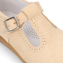 Classic suede leather T-strap shoes with toe cap and buckle fastening.