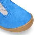 Classic suede leather T-strap shoes with toe cap and buckle fastening.