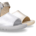 Metal finish leather sandals with buckle fastening and super flexible soles for little girls.
