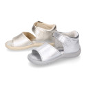 Metal finish leather sandals with buckle fastening and super flexible soles for little girls.