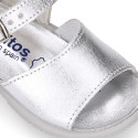 Metal finish leather sandals with buckle fastening and super flexible soles for little girls.