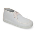 Cotton canvas Wallabee style bootie shoes with ties closure.