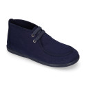 Cotton canvas Wallabee style bootie shoes with ties closure.