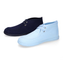 Cotton canvas Wallabee style bootie shoes with ties closure.