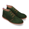 Suede leather ankle boots Oxford style with shoelaces and outsole in contrast.