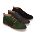 Suede leather ankle boots Oxford style with shoelaces and outsole in contrast.