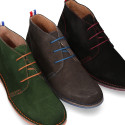 Suede leather ankle boots Oxford style with shoelaces and outsole in contrast.