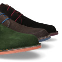 Suede leather ankle boots Oxford style with shoelaces and outsole in contrast.