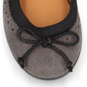 Suede leather ballet flat shoes with elastic band and perforated design.