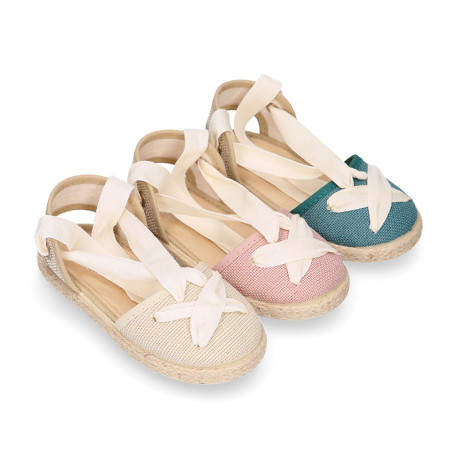 Cotton and linen canvas espadrille shoes Goyesca style with crossed ties in pastel colors.