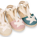 Cotton and linen canvas espadrille shoes Goyesca style with crossed ties in pastel colors.