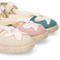 Cotton and linen canvas espadrille shoes Goyesca style with crossed ties in pastel colors.
