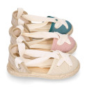 Cotton and linen canvas espadrille shoes Goyesca style with crossed ties in pastel colors.