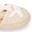 Cotton and linen canvas espadrille shoes Goyesca style with crossed ties in pastel colors.