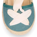 Cotton and linen canvas espadrille shoes Goyesca style with crossed ties in pastel colors.