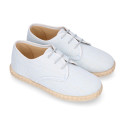 Linen kids laces up shoes espadrille style in pastel colors.