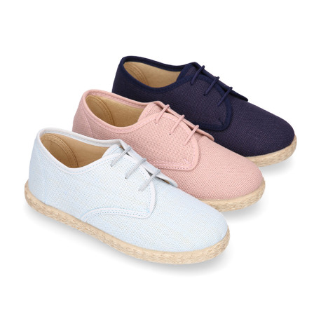 Linen kids laces up shoes espadrille style in pastel colors.