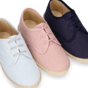 Linen kids laces up shoes espadrille style in pastel colors.