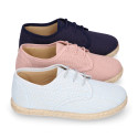 Linen kids laces up shoes espadrille style in pastel colors.