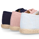 Linen kids laces up shoes espadrille style in pastel colors.