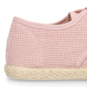 Linen kids laces up shoes espadrille style in pastel colors.