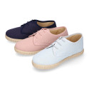 Linen kids laces up shoes espadrille style in pastel colors.