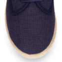 Linen kids laces up shoes espadrille style in pastel colors.