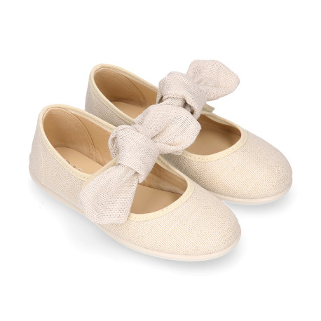 Stylized little Girl Mary Jane shoes with hook and loop strap with bow in ivory linen.