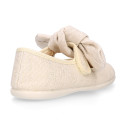 Stylized little Girl Mary Jane shoes with hook and loop strap with bow in ivory linen.