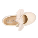 Stylized little Girl Mary Jane shoes with hook and loop strap with bow in ivory linen.