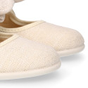 Stylized little Girl Mary Jane shoes with hook and loop strap with bow in ivory linen.