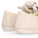 Stylized little Girl Mary Jane shoes with hook and loop strap with bow in ivory linen.