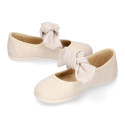 Stylized little Girl Mary Jane shoes with hook and loop strap with bow in ivory linen.